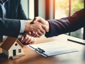 Coco Development Group representing the contrast between property developers vs real estate agents through a business handshake and housing deal.