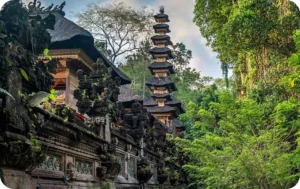 Traditional Balinese temple nestled in lush jungle greenery in Ubud, showcasing spiritual and cultural destinations featured by Coco Development Group.