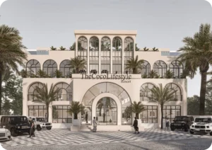 Elegant white resort building labeled “The Coco Lifestyle Resort” with arched windows, palm trees, and luxury vehicles parked in front, representing high-end property development in Bali.