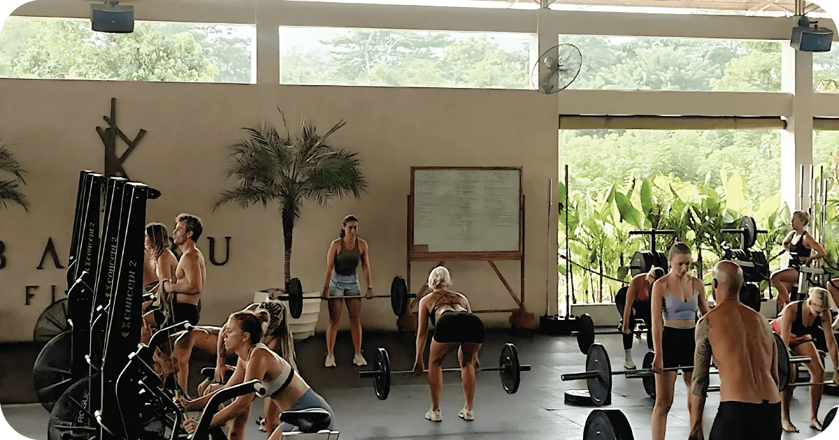 Bambu Fitness group strength class with barbells and SkiErgs