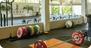 Bambu Fitness weightlifting zone with bumper plates, platforms and bikes