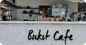 Bukit Cafe stone-front bar counter with espresso machine and tools