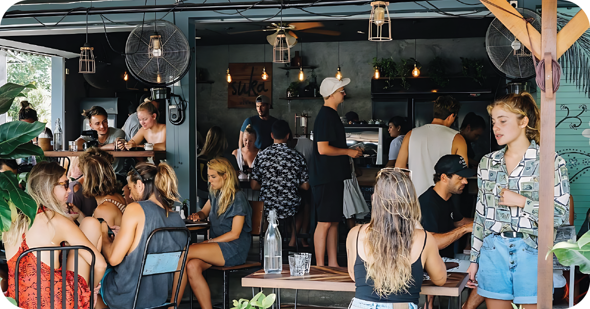 Bustling café interior with counter service and shared tables