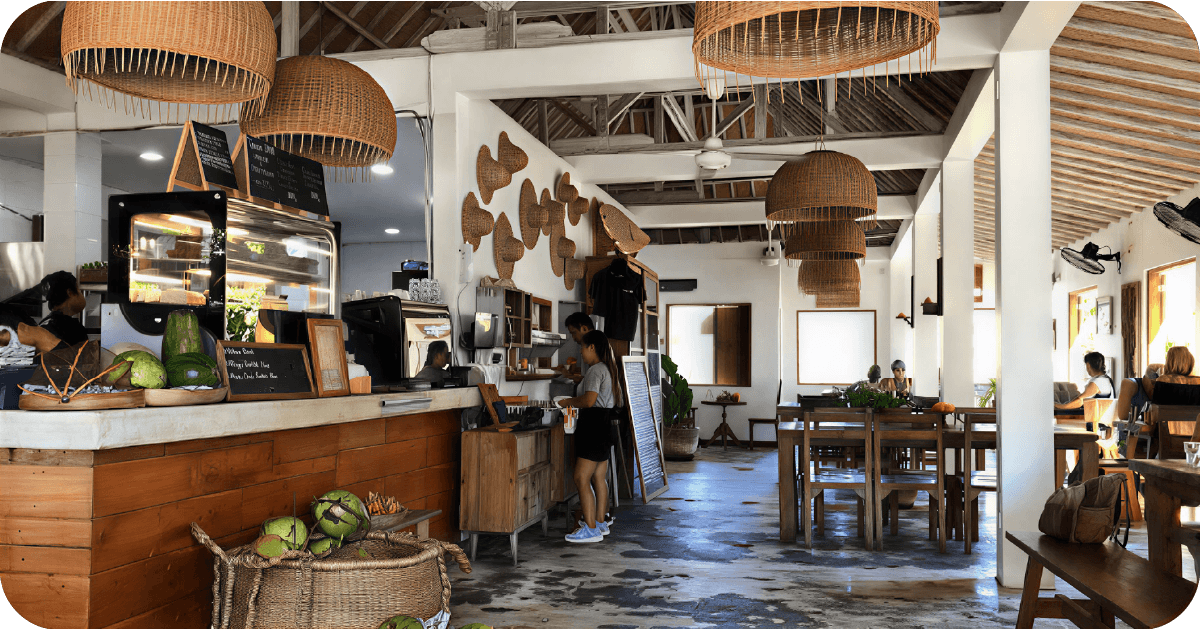 Casual counter-service setup with chalkboard menus and wicker lamps