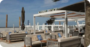 Karma Beach outdoor lounge with cabanas and cushioned sofas