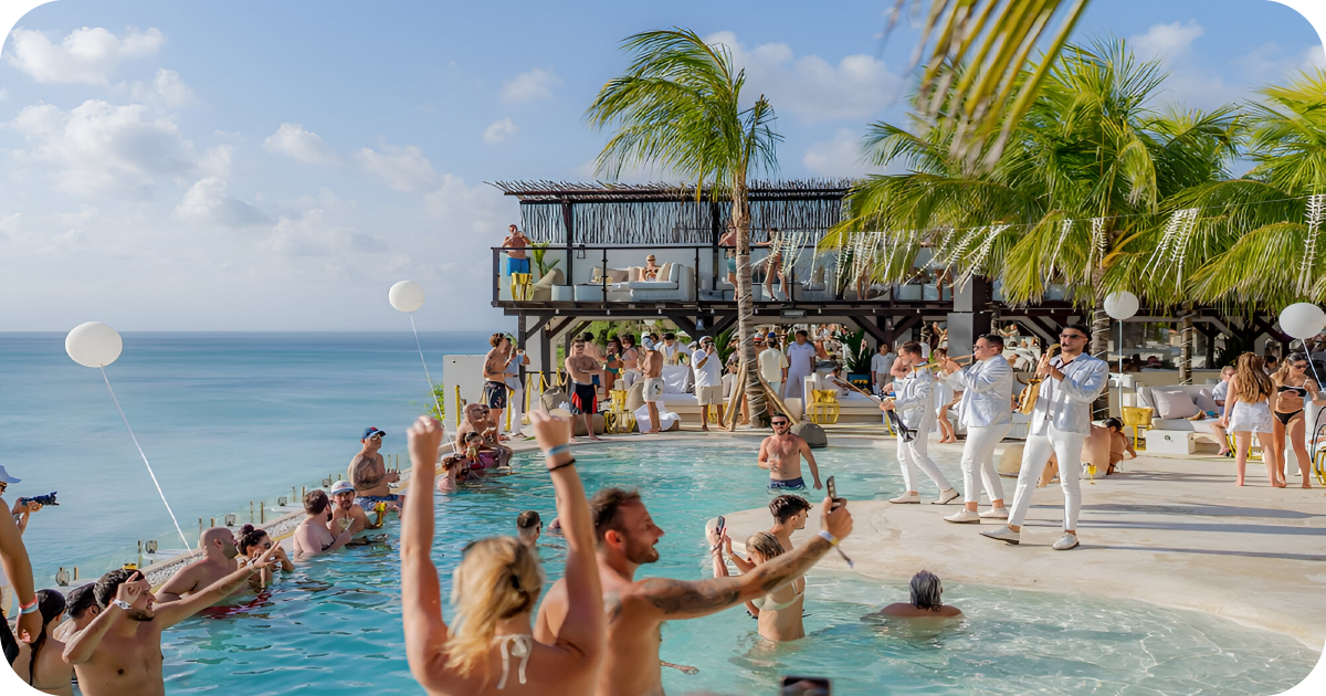 Lively pool party with live band and ocean backdrop