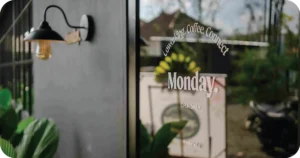 Monday glass door with coworking, coffee, connect signage
