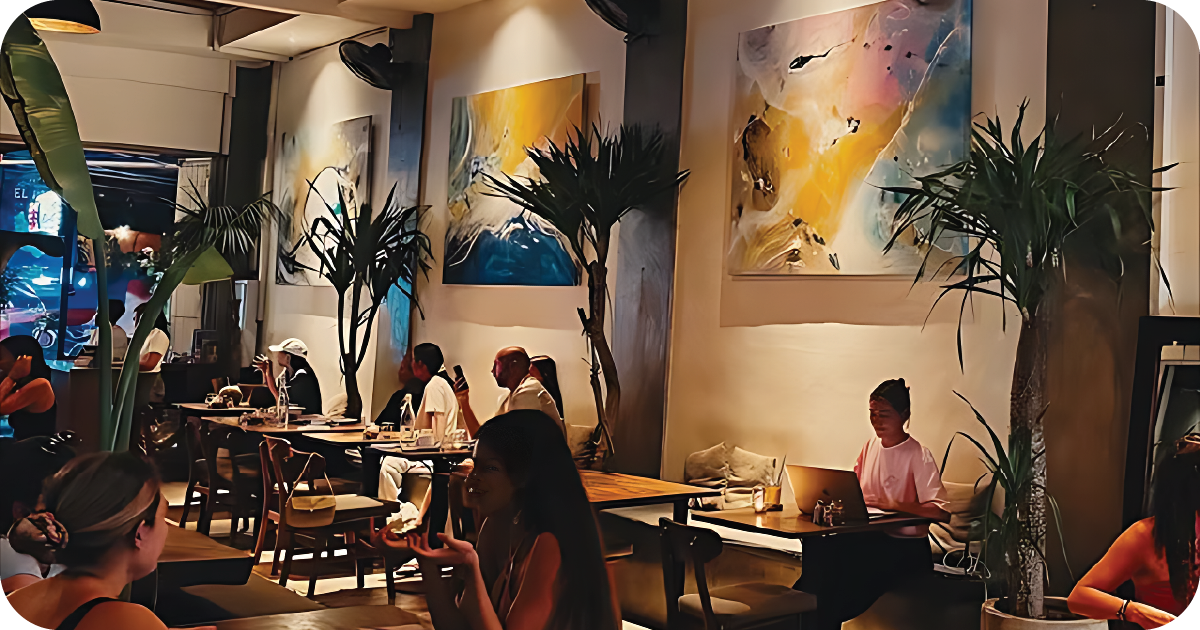 Moody dining room with abstract art and indoor palms