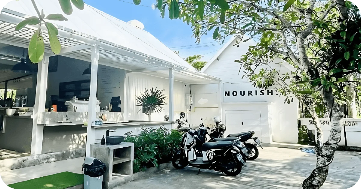 NOURISH. airy white cafe with open counter and scooter parking