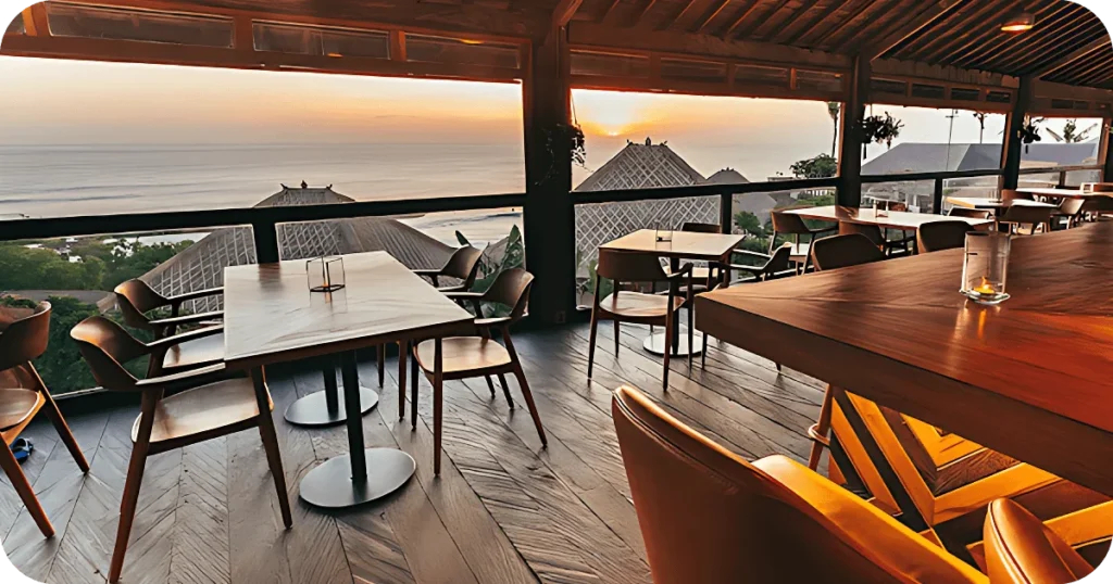 Open-air dining room with ocean views and wooden tables
