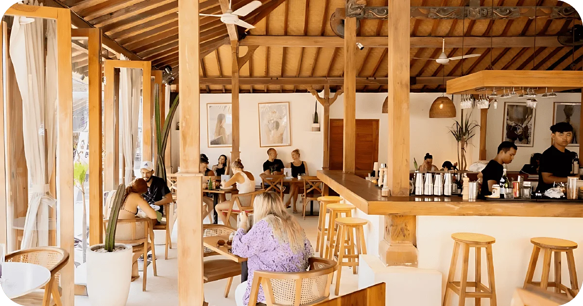 Open wooden bar with high stools and casual cafe seating