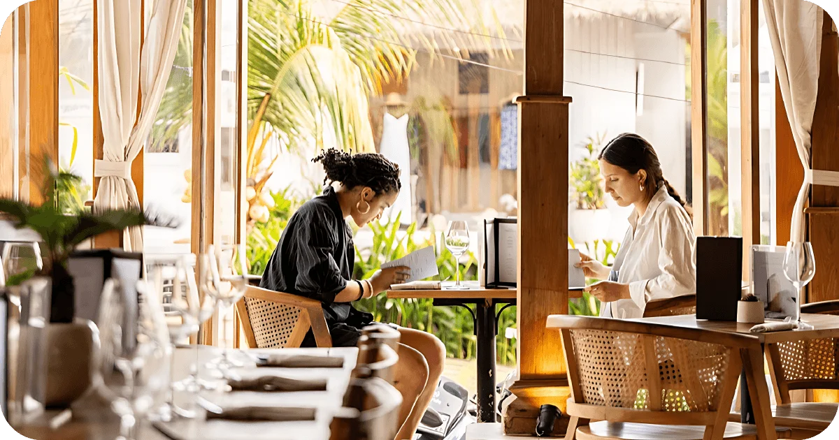 Sunlit dining room with rattan chairs and wooden accents