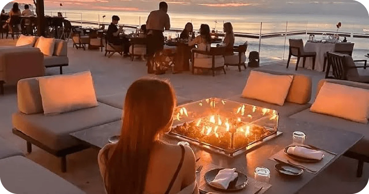 Sunset terrace seating around a glass fire pit