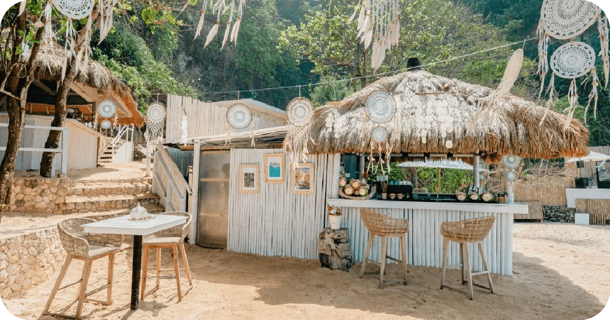 Thatched beach bar with dreamcatchers and rattan stools