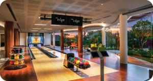 The Edge two-lane bowling alley beside garden-view lounge
