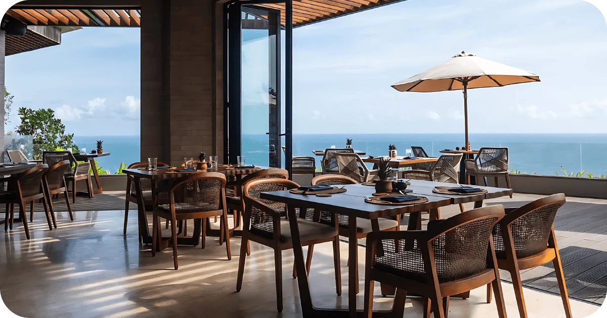 Airy indoor-outdoor dining room overlooking the sea