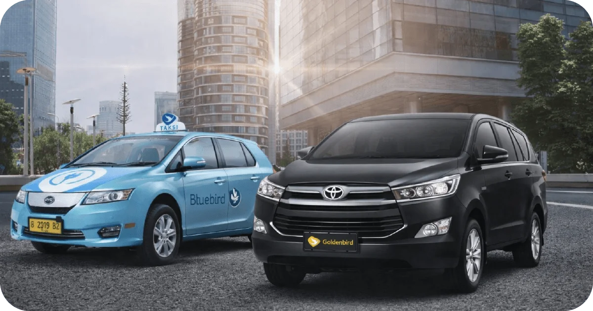 Bluebird taxi and Goldenbird Toyota MPV parked on city street