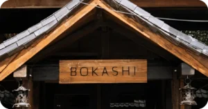 Bokashi wooden entrance sign under gabled roof