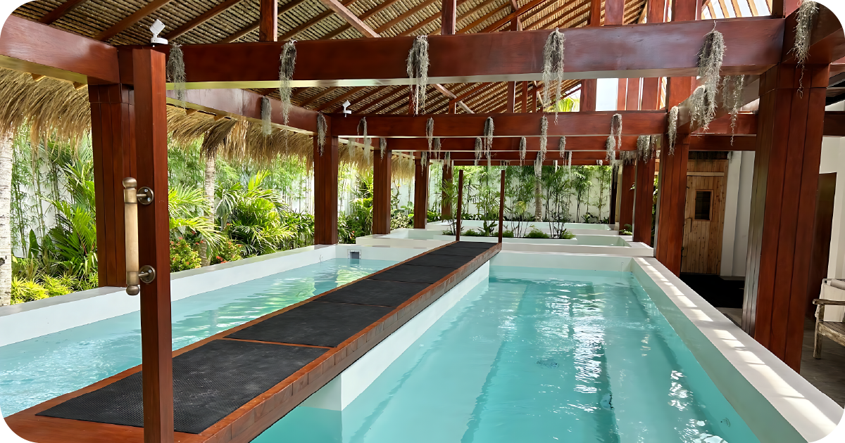 Covered hydrotherapy pools with balance beam and nearby sauna