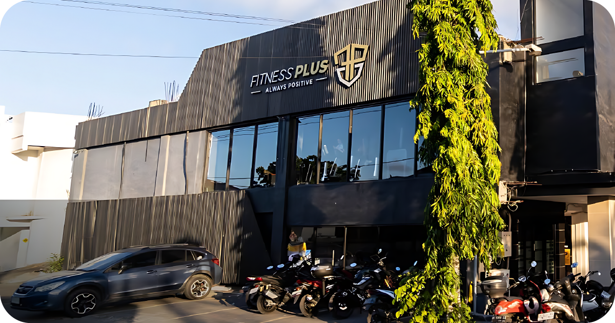Fitness Plus exterior with parking and large front sign