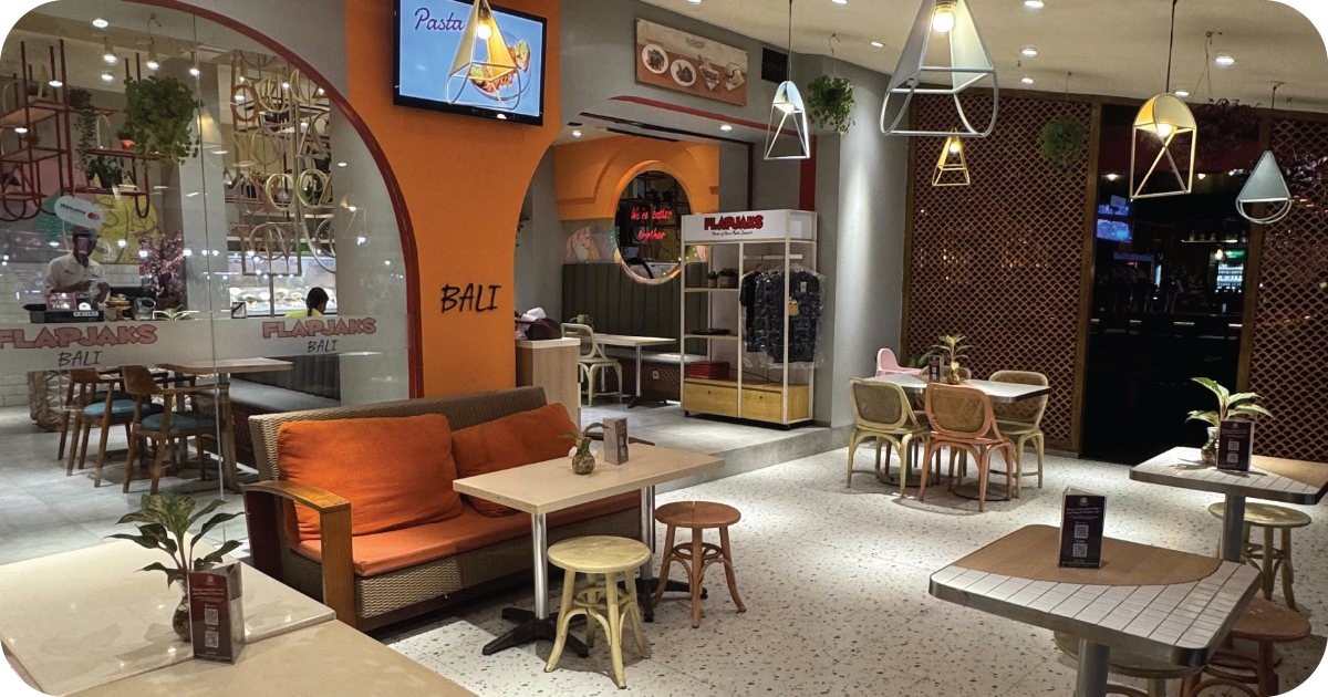 Flapjaks Bali dining room with sofas, pendant lights, and open layout