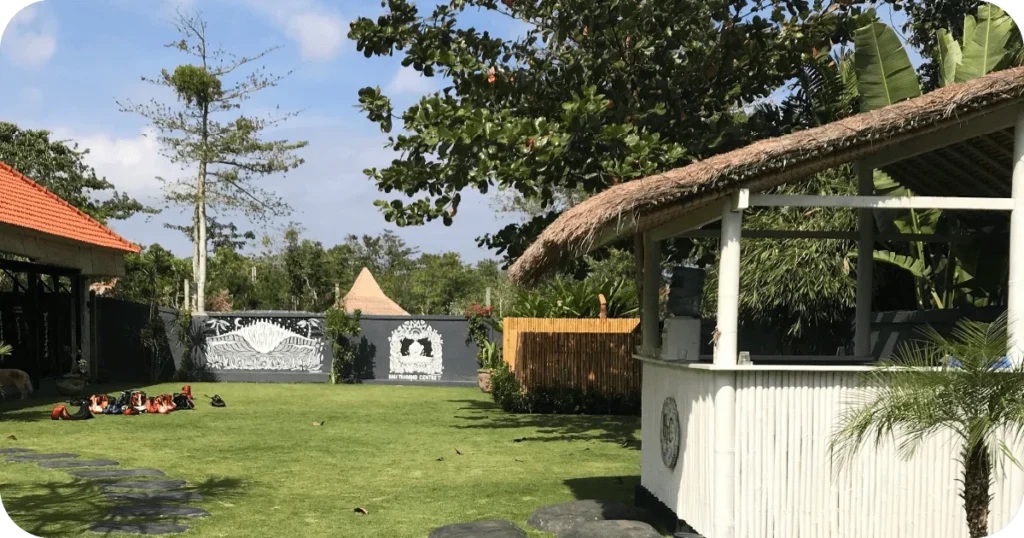 Bali Training Centre: Garden lawn with thatched refreshment hut and training gear