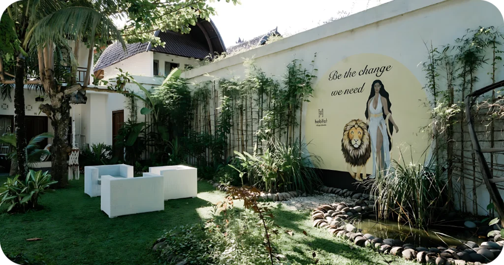 Health Club Gym Uluwatu: Garden lounge with mural and pond, Habitat Village signage