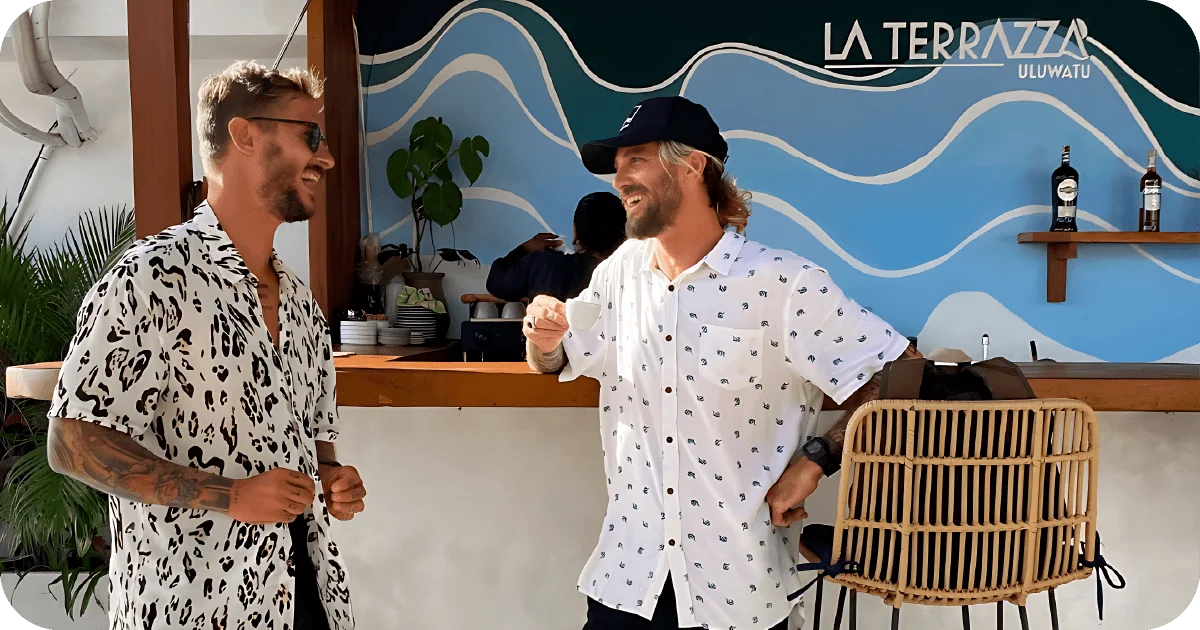 La Terrazza Uluwatu bar with wave mural and patrons chatting