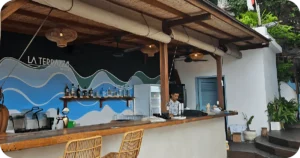 La Terrazza Uluwatu beachy bar with wave mural and bottle shelf