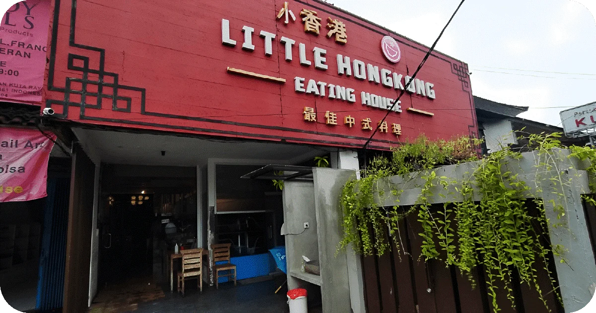 Little Hongkong Eating House red storefront with open entrance and hanging plants