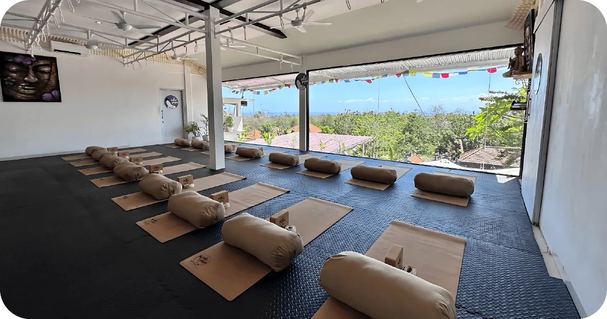 Open-air yoga studio set with mats, bolsters and blocks