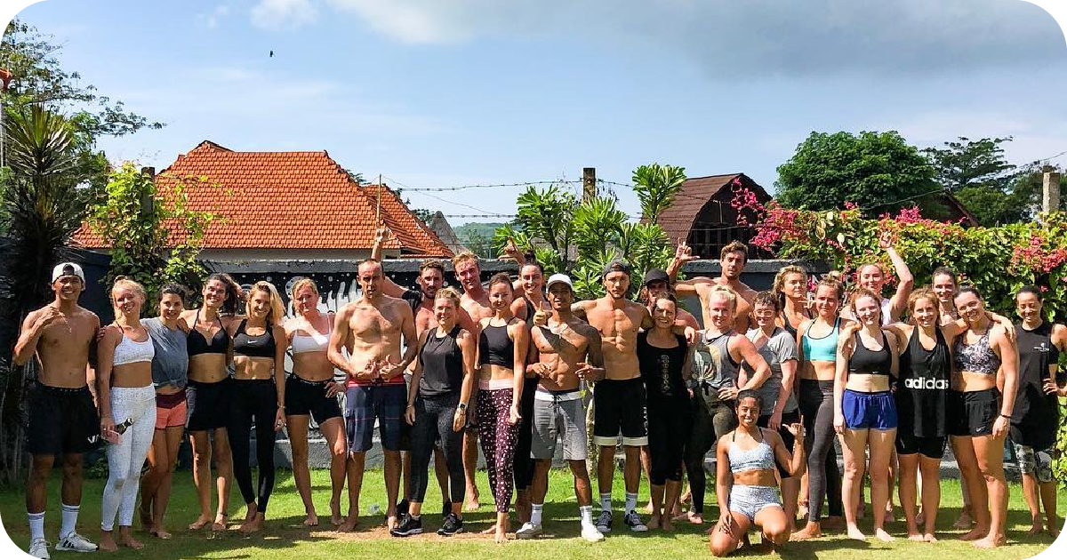 Outdoor fitness group photo on lawn after workout