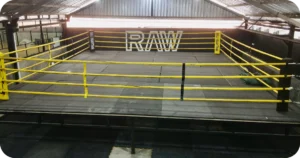 Raw Gym Uluwatu: boxing ring with yellow ropes under covered warehouse roof