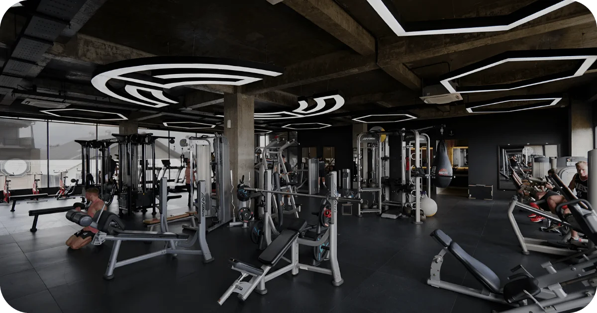 Surya Gym Bali: The Ultimate Review of Canggu's Premier Fitness Destination 1 Spacious weight room with selectorized machines and distinctive ceiling lights