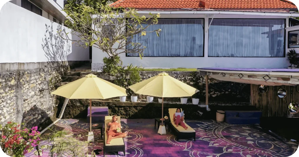 Sun terrace with loungers and umbrellas for post-class relaxation