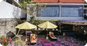 Sun terrace with loungers and umbrellas for post-class relaxation