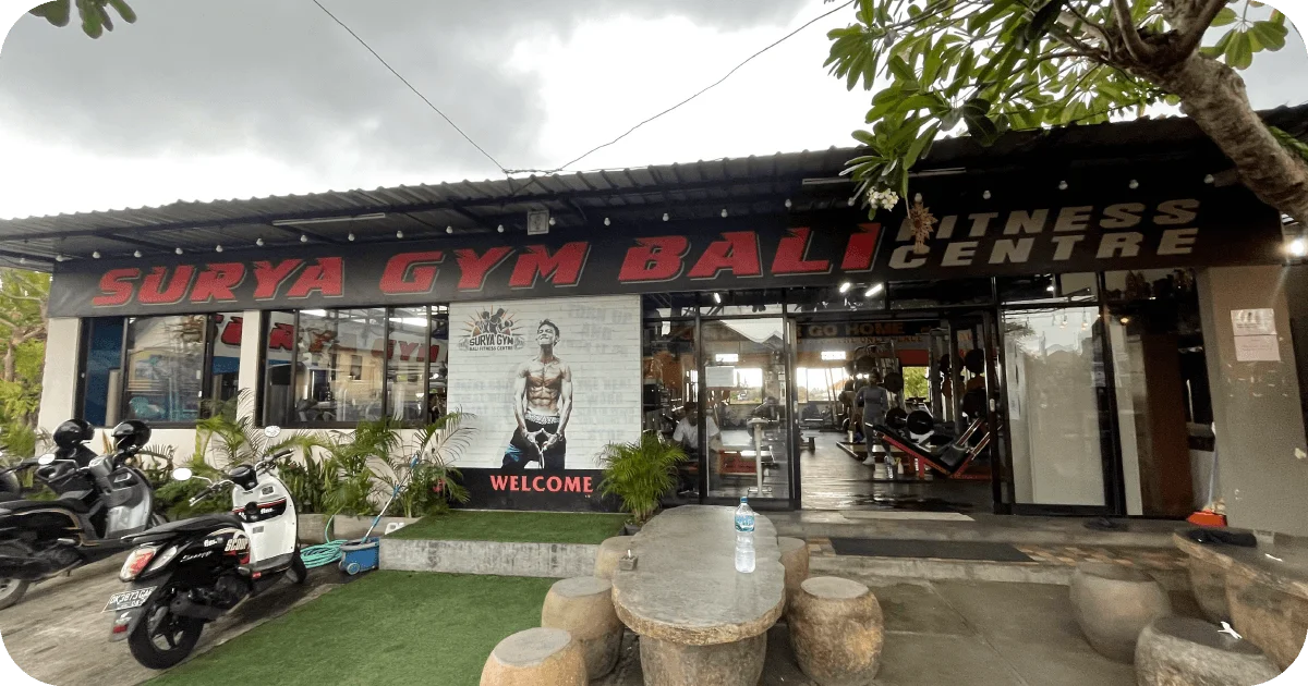 Surya Gym Bali: The Ultimate Review of Canggu's Premier Fitness Destination 6 Surya Gym Bali entrance with scooters and welcome sign
