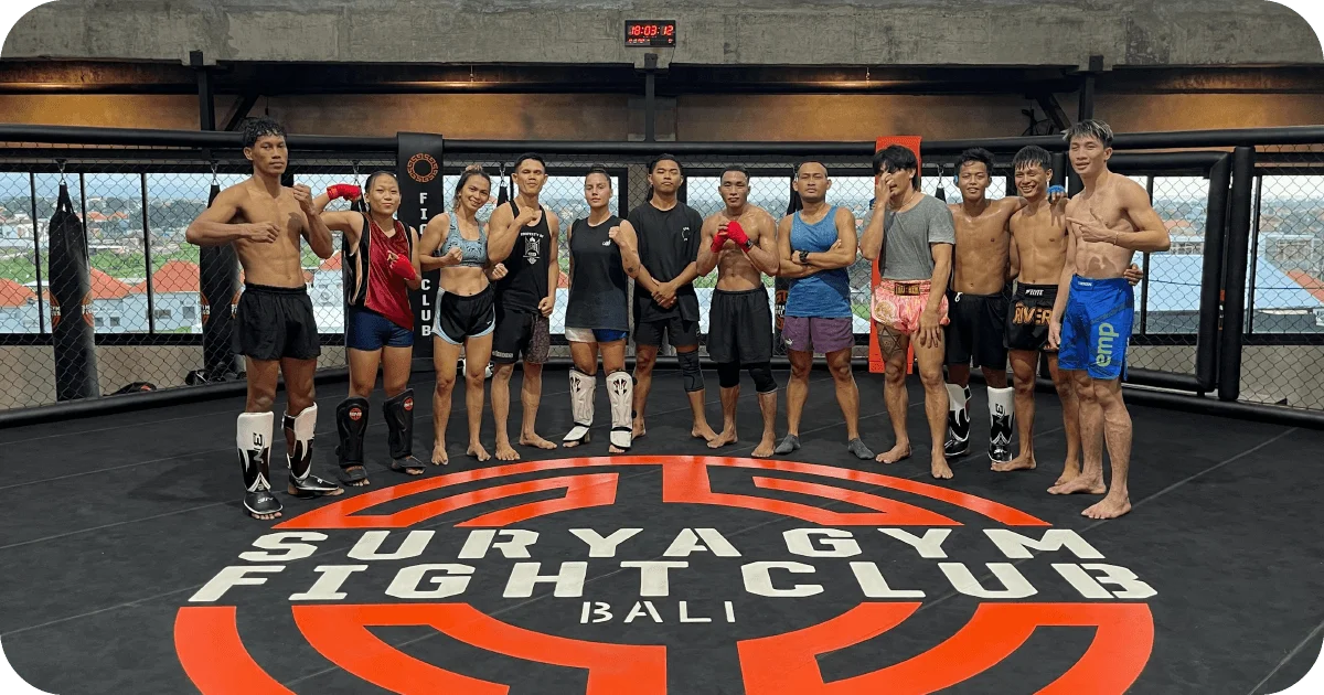 Surya Gym Bali: The Ultimate Review of Canggu's Premier Fitness Destination 4 Surya Gym Fight Club group on MMA cage floor