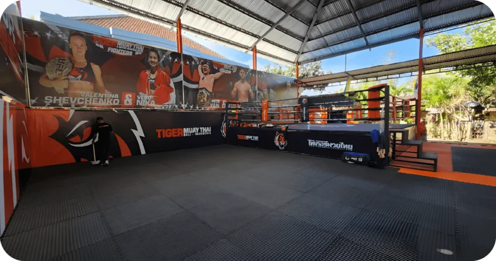 Tiger Muay Thai Bali ring in covered outdoor area with posters