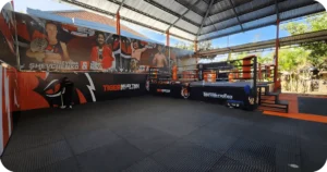 Tiger Muay Thai Bali ring in covered outdoor area with posters