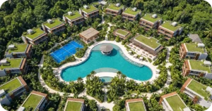 Buy investment property in bali apartments: Aerial view of jungle resort with lagoon pool and tennis courts